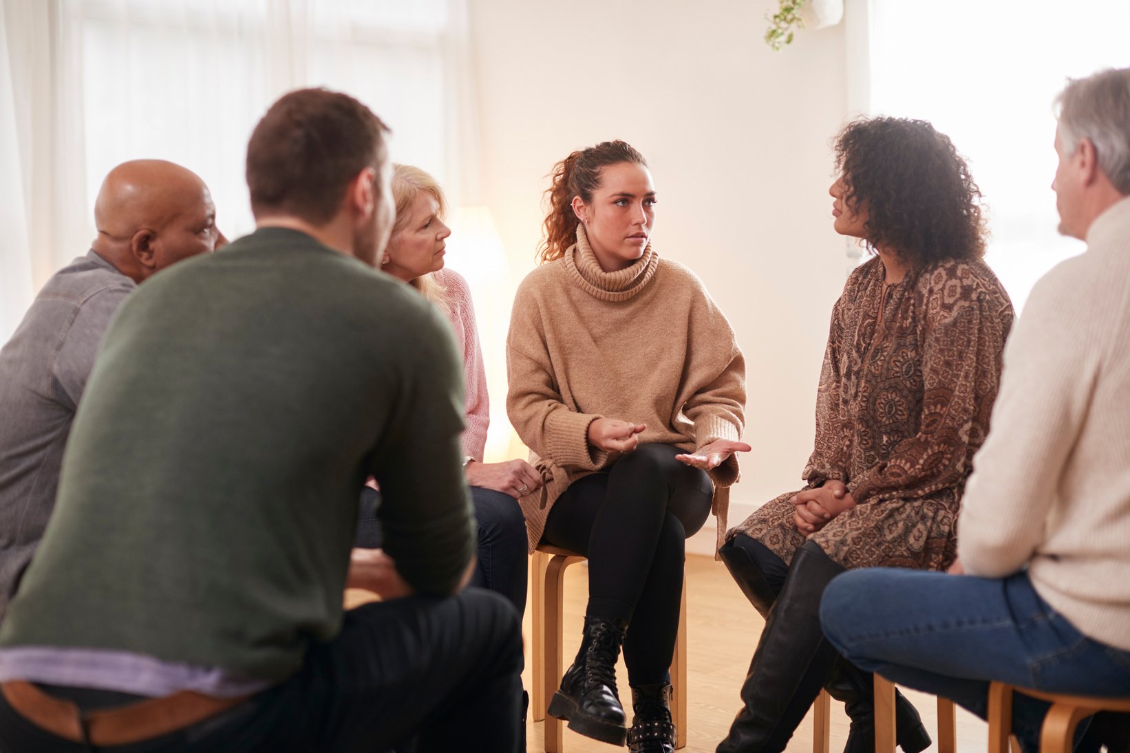 Woman Speaking at Support Group Meeting for Mental Health or Dep